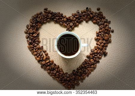 Cup Of Coffee With Heart Of Beans