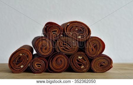 Sweet Pureed Fruit Pastille. Fruit Roll-ups Homemade. Natural Sweets From Dried Berries And Fruits. 