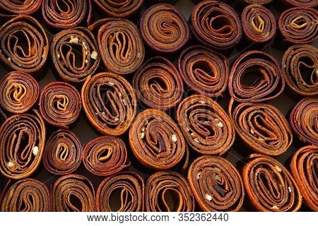 Sweet Pureed Fruit Pastille. Fruit Roll-ups Homemade. Natural Sweets From Dried Berries And Fruits. 