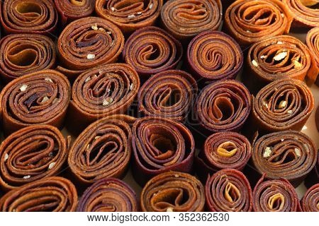 Sweet Pureed Fruit Pastille. Fruit Roll-ups Homemade. Natural Sweets From Dried Berries And Fruits. 