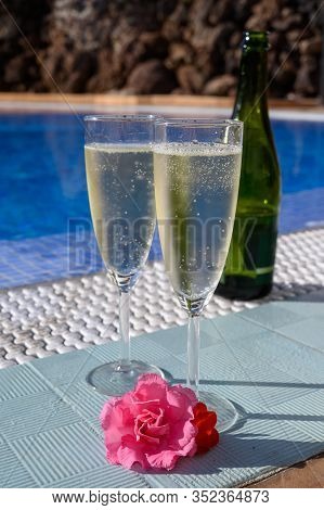 Pool Party With Two Glasses Of Bubbles White Champagne Or Cava Wine, Romantic Event On All Inclusive