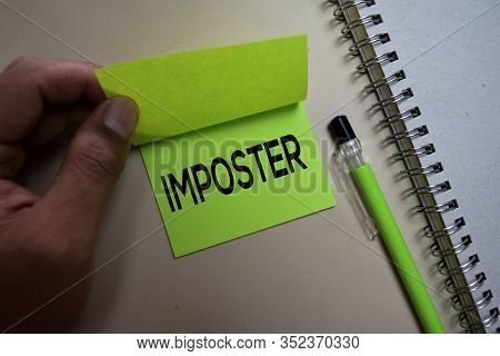 Imposter Text On Sticky Notes Isolated On Office Desk