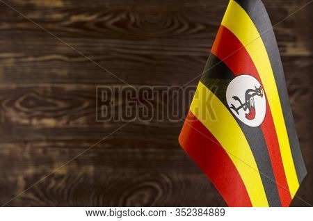 Fragment Of The Flag Of The Republic Of Uganda In The Foreground Space For Text Blurred Background