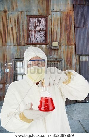   Coronavirus. COVID-19.  Coronavirus Disease 2019. A Doctor holds in his hands a beaker of CORONAVIRUS. COVID-19 AKA Corona Virus is spreading world wide. COVID-19 is also in the United States. 