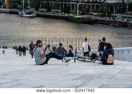Editorial 08.31.2019 Oslo Norway Seagull Scares A Man That Tries To Feed Him And Girls Is Laughing