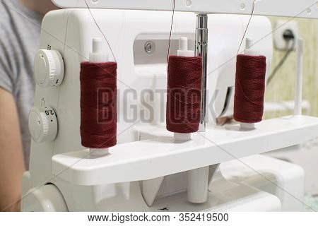 Sewing Machine For Wrapping Sections Of Textile Materials