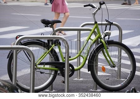 Krakow, Poland- 07.30.2019: Parking For Bicycles And Scooters, Convenient City, Eco-friendly Movemen