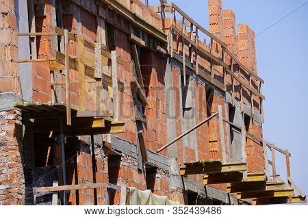 New Building Under Construction And Construction Site Of A Residential Building. The Formation Of Ce