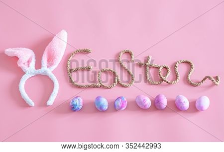 Easter Creative Inscription On A Pink Background .