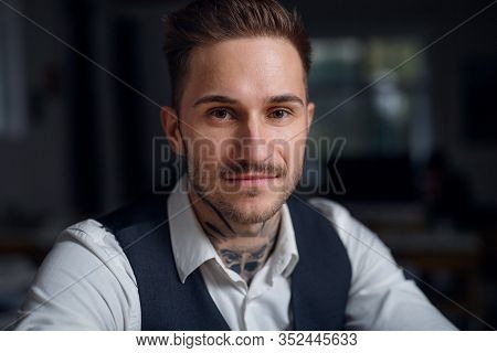 A Front View Of Young Businessman Indoors In Office.