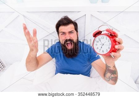 Feeling Tired And Stressed. Stressed Man Shouting At The Alarm Clock. Hate Noise Of Alarm Clock. Man