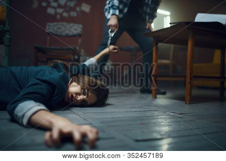 Maniac kidnapper drags his victim across the floor