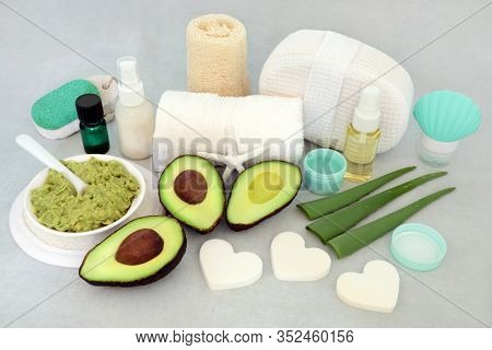 Skincare beauty treatment with aloe vera and avocado with facial mask, essential oil, moisturising cream and oil with cleansing products.