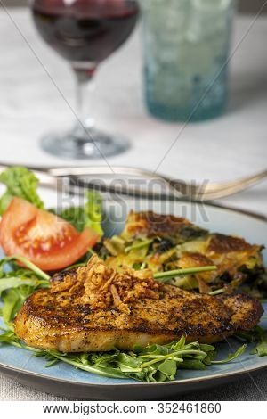 Grilled Pork Steak On Lambs Lettuce With Wine