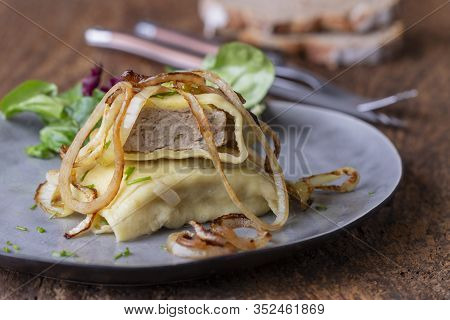 Swabian Maultasche With Onions On A Plate