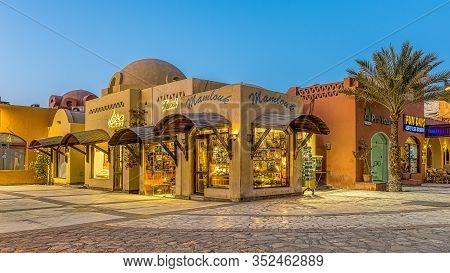Illuminated Shops And Buildings At An Egyptian Square In The Twilight Sunset, El Gouna, Egypt, Janua