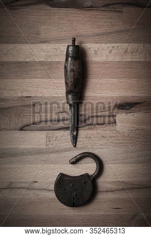 Murder Mystery Or Crime Thriller Concept  Of Knife Weapon And Unlocked Padlock