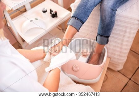 Pedicure For Feet, Foot In A Towel After Spa Pedicure Treatment, Drying Of A Foot With Towel