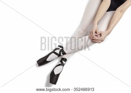 Sport Concepts. Ballet Dancer Sexy Legs In Laced Pointes Shoes. Posing With Straight And Crossed Leg