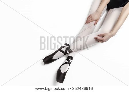 Sport Concepts. Ballet Dancer Sexy Legs In Laced Pointes Shoes. Posing With Straight And Crossed Leg