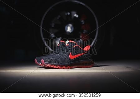 Perfect Nike Air Max 2017 Sport Shoes Shot Near The Mercedez Benz Car On Dark Background. Sport And