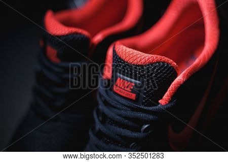 Perfect Nike Air Max 2017 Sport Shoes Shot Near The Mercedez Benz Car On Dark Background. Sport And