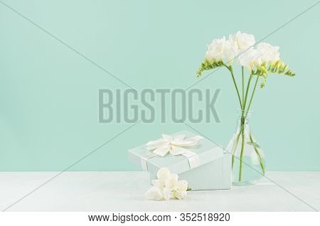 Spring Gentle Fresh Celebration Background With Opened Gift Box And Flowers In Glass Vase In Elegant
