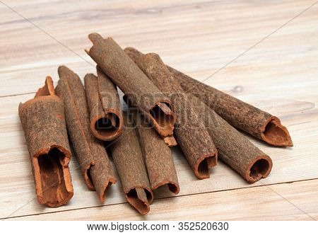 Cinnamon,  Cinnamomum Cassia Called Chinese Cassia.  Also Chinese Cinnamon, Sticks On The Wooden Tab