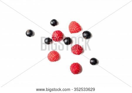 Assortment Of Berries. Sweet Raspberries And Black Currants Berry Isiolated On White Background