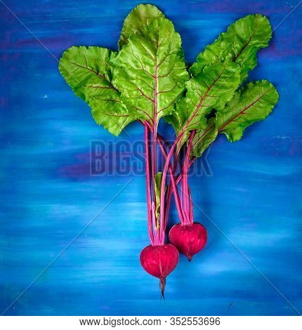 Beetroot Cut In Half On A Blue Background, Place For Text, Healthy Food