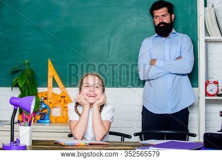 Homeschooling With Father. Pedagogue Skills. School Teacher And Schoolgirl. Work Together To Accompl