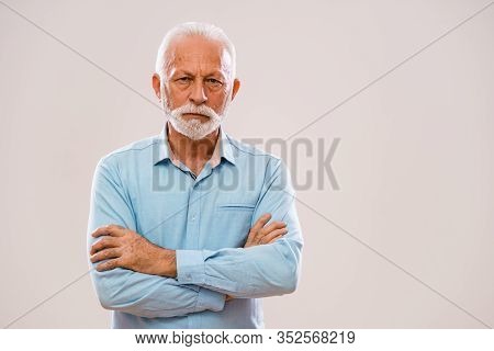 Portrait Of Pensive And Serious Senior Man.