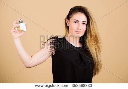Share The Secret. Pretty Woman Hold Perfume. Perfumery Shop. Woman With Bottle Of Perfume. Girl Appl