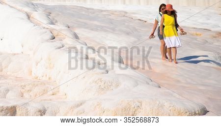 Pamukale / Turkey 17th Sep 2019 :two Ladies Walking Over The Pamukkale White Sedimentary Rocks.