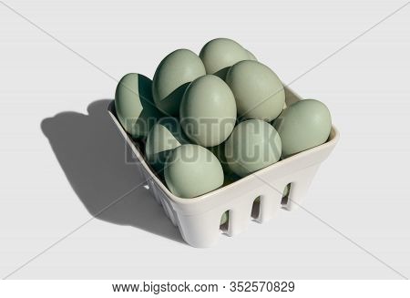 Araucana Egg On Basket Isolated On White Background. Blue Or Green Eggs From Araucana Chicken