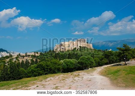 Famous greek tourist landmark - the iconic Parthenon Temple at the Acropolis of Athens as seen from Philopappos Hill, Athens, Greece