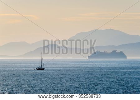 Cruise liner ship and yacht silhouette in Mediterranea sea. Aegean sea, Greece