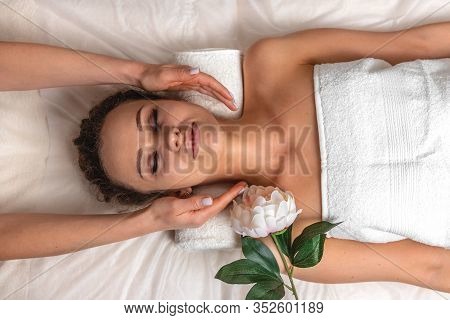 Cute Young Girl With Closed Eyes, Thick Eyebrows And Perfect Skin During Neck Massage, Woman Relaxin
