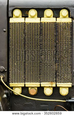 Close Up On Metal Radiator Element Detail. Agricultural Machines Vahicles Objects Concept.