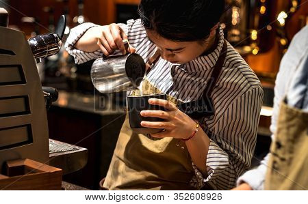 Shanghai, China - January 11, 2020: A Starbucks Barista Making Coffee For Their Customer At The Star