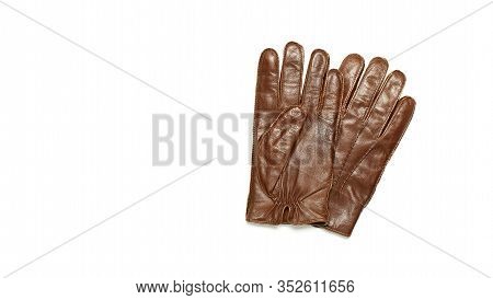 Brown Classic Leather Mens Gloves On White Isolated Background Top View. Stylish Fashionable Winter 