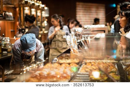 Shanghai, China - January 11, 2020: A Starbucks Barista Making Coffee For Their Customer At The Star
