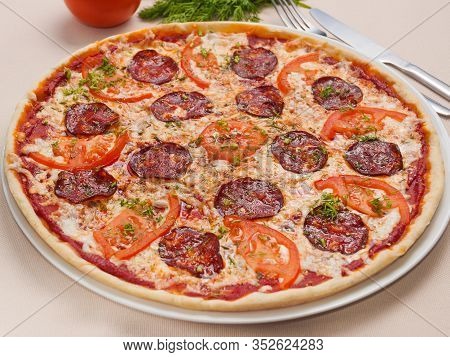 Delicious Pepperoni Pizza With Tomatoes And Mozzarella