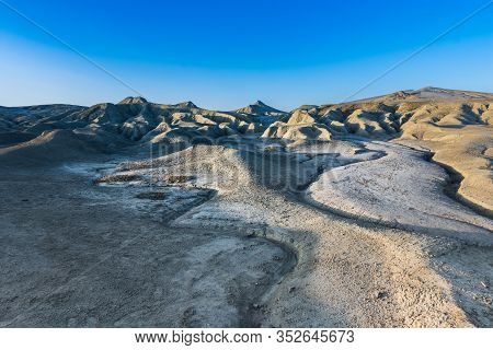 Beautiful Lunar Landscape With Golden Light At Sunset Over The Muddy Volcanoes, Paclele, Berca, Buza