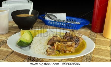 Enfocado De Costilla -ribbed Shrink In Spanish Language- Plate Of Bone Rib Meat Accompanied With Whi