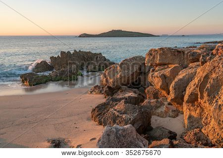 Porto Covo Beach At Sunset With Ilha Do Pessegueiro Island On The Background, In Portugal