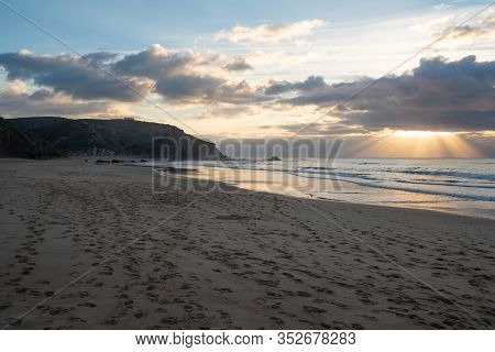 Praia Do Amado Beach At Sunset In Costa Vicentina, Portugal