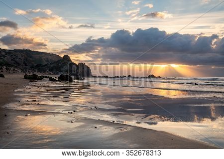 Praia Do Amado Beach At Sunset In Costa Vicentina, Portugal