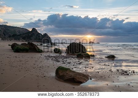 Praia Do Amado Beach At Sunset In Costa Vicentina, Portugal