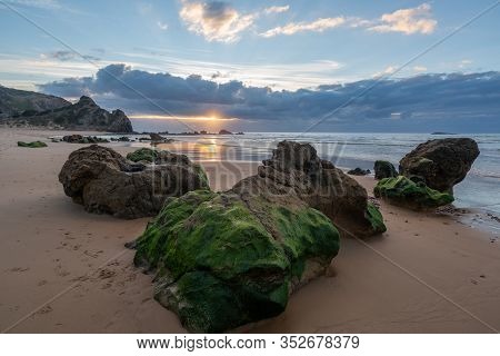 Praia Do Amado Beach At Sunset In Costa Vicentina, Portugal